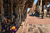 The great Chola temples of Tamil Nadu - The Brihadishwara Temple of Thanjavur. Brihadnayaki Temple (Amman temple) pilgrims resting in the shade of the mandapa.